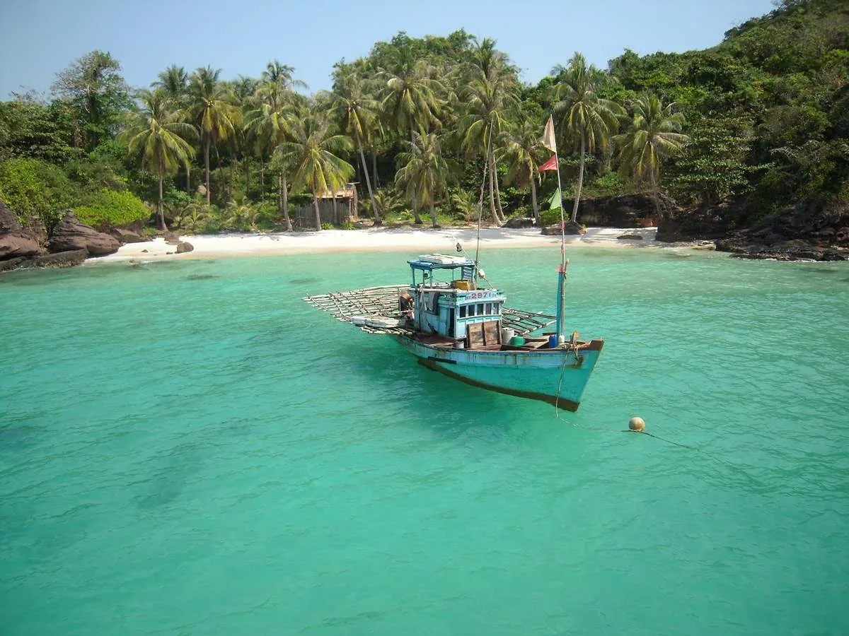 A boat on emerald water